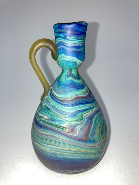 Pear shaped single handle vase with candlestick
                  opening