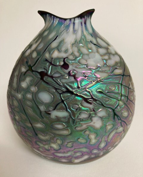 Iridescent green pouch vase with white forms